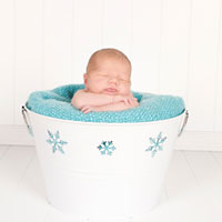 Baby Hendrix in a snow bucket