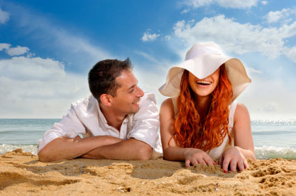 Couple laughing on the beach