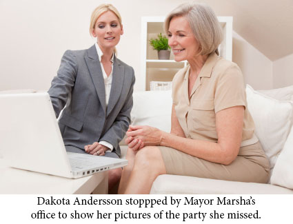 Dakota showing pictures to Mayor Marsha